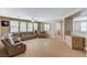 Living area featuring tile floors, a ceiling fan, and natural light at 221 Raptors View Ave, Las Vegas, NV 89031