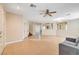 Spacious living room with tile floors and ceiling fan at 221 Raptors View Ave, North Las Vegas, NV 89031