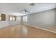 Spacious living room featuring tile flooring, neutral walls, abundant natural light and contemporary ceiling fan at 221 Raptors View Ave, Las Vegas, NV 89031