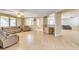 Bright living room with tile floors and large windows at 221 Raptors View Ave, North Las Vegas, NV 89031