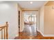 Hallway view of a large bedroom with hardwood floors and a four poster bed at 221 Raptors View Ave, Las Vegas, NV 89031