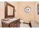 Cozy bathroom features a stained glass window, granite countertops, and wood cabinets at 24 Wild Dunes Ct, Las Vegas, NV 89113