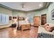 Bright bedroom with hardwood floors, decorative ceiling, and a four poster bed with lots of natural light at 24 Wild Dunes Ct, Las Vegas, NV 89113