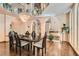 Formal dining room with modern chandelier and large windows at 24 Wild Dunes Ct, Las Vegas, NV 89113