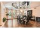 Elegant dining room showcasing mirrored ceiling, chandelier, and bright windows at 24 Wild Dunes Ct, Las Vegas, NV 89113