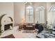 Bright home office with fireplace, tiled floors, large arched windows and plantation shutters at 24 Wild Dunes Ct, Las Vegas, NV 89113