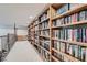 Library nook featuring floor to ceiling bookcase with railing at 24 Wild Dunes Ct, Las Vegas, NV 89113