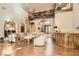 Open living room featuring soaring ceilings, hardwood floors, and custom built-in bookcase at 24 Wild Dunes Ct, Las Vegas, NV 89113