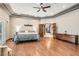 Expansive main bedroom with beautiful hardwood floors, detailed trim, and stylish furnishings at 24 Wild Dunes Ct, Las Vegas, NV 89113