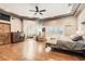 Spacious main bedroom with hardwood floors, ceiling fan, recessed lights and sitting area at 24 Wild Dunes Ct, Las Vegas, NV 89113