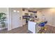 Modern kitchen featuring white cabinets, stainless steel appliances, and blue accent wall at 2558 Petunia Garden Ave # 217, North Las Vegas, NV 89081