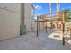 Backyard with pergola, AC unit and tile flooring at 2619 Grey Stone Rd, Henderson, NV 89074