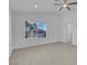 Spacious bedroom with large window, ceiling fan, and light wood flooring at 2619 Grey Stone Rd, Henderson, NV 89074