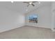 Bright bedroom with wood-look floors, a large window and ceiling fan at 2619 Grey Stone Rd, Henderson, NV 89074