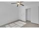 Well-lit bedroom with ceiling fan and sliding door closet at 2619 Grey Stone Rd, Henderson, NV 89074