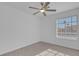 Bright bedroom with a ceiling fan and large window at 2619 Grey Stone Rd, Henderson, NV 89074