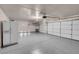 Garage with double doors, epoxy flooring, and ample storage at 2619 Grey Stone Rd, Henderson, NV 89074