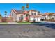 Two-story house with solar panels and red door at 2619 Grey Stone Rd, Henderson, NV 89074