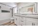 Modern bathroom with double vanity and large mirror at 275 Adorno Dr, Henderson, NV 89074