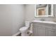 Updated bathroom with gray vanity and a modern toilet at 275 Adorno Dr, Henderson, NV 89074