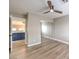 Bedroom with mirrored closet doors and wood-look floors at 275 Adorno Dr, Henderson, NV 89074