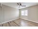 Bright bedroom with wood-look floors and ceiling fan at 275 Adorno Dr, Henderson, NV 89074