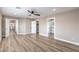 Bright bedroom with wood-look floors, and access to two bathrooms at 275 Adorno Dr, Henderson, NV 89074