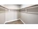 Walk-in closet with wood-look floors and ample hanging space at 275 Adorno Dr, Henderson, NV 89074