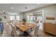 Bright dining room with a wood table and access to the backyard patio at 275 Adorno Dr, Henderson, NV 89074