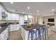 Modern kitchen with white cabinets, a large island, and stainless steel appliances at 275 Adorno Dr, Henderson, NV 89074