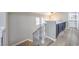 Upstairs hallway with a built-in cabinet and a staircase at 275 Adorno Dr, Henderson, NV 89074