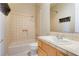 Clean bathroom with tile flooring, shower/tub combo, and a single vanity at 3 Glendora Ct, Henderson, NV 89052