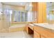 Elegant bathroom with double vanity, soaking tub, and walk-in shower at 3 Glendora Ct, Henderson, NV 89052