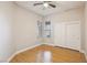 Bright bedroom with wood-look flooring, ceiling fan, and ample closet space at 3 Glendora Ct, Henderson, NV 89052