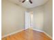 Well-lit bedroom with wood floors, ceiling fan, and access to a bathroom at 3 Glendora Ct, Henderson, NV 89052