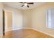 Spacious bedroom with wood-look flooring and a large window for natural light at 3 Glendora Ct, Henderson, NV 89052