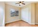 Bedroom with wood-look floors, ceiling fan, and sliding door closet at 3 Glendora Ct, Henderson, NV 89052