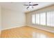 Spacious bedroom with hardwood floors and large windows with shutters at 3 Glendora Ct, Henderson, NV 89052