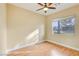 Well-lit bedroom with wood-look floors and ceiling fan at 3 Glendora Ct, Henderson, NV 89052