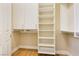 Spacious closet with shelves, drawers, and hanging rods at 3 Glendora Ct, Henderson, NV 89052