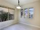 Bright dining room with large windows and a modern light fixture at 3 Glendora Ct, Henderson, NV 89052