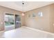 Dining area with sliding door to backyard and modern light fixture at 3 Glendora Ct, Henderson, NV 89052