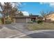 Single-story home with neutral exterior, attached garage, and landscaped yard at 3 Glendora Ct, Henderson, NV 89052