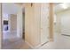 Bright hallway with light flooring and access to laundry and other rooms at 3 Glendora Ct, Henderson, NV 89052