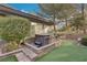 Hot tub nestled in a stone enclosure in the backyard at 3 Glendora Ct, Henderson, NV 89052