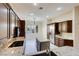 Kitchen with granite countertops and dark wood cabinetry at 3 Glendora Ct, Henderson, NV 89052