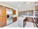 Modern kitchen with stainless steel appliances and light wood cabinets at 3 Glendora Ct, Henderson, NV 89052