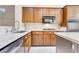 Granite countertop kitchen with stainless steel appliances and a large sink at 3 Glendora Ct, Henderson, NV 89052