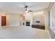 Spacious living room featuring a stone fireplace and built-in entertainment center at 3 Glendora Ct, Henderson, NV 89052