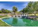 Serene pond with waterfalls in landscaped area at 3 Glendora Ct, Henderson, NV 89052